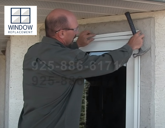 Window replacement technician installing a new window at a Walnut Creek home